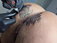 Whoa, check out how I'm modifying the tattoo around my ass - it's way bigger now than before!