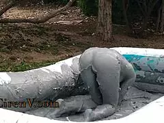 I'm covering myself in clay while sploshing in the pool