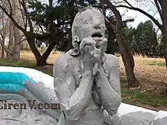I'm covering myself in clay while sploshing in the pool
