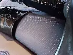 total black with fishnets pantyhose and boots over the knee. hey, check out this all-black outfit with fishnets and knee-high boots