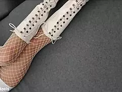 That perfect ass milf struts in high-heeled boots and fishnet stockings but what's underneath?