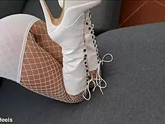That perfect ass milf struts in high-heeled boots and fishnet stockings but what's underneath?