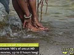 Giggles' feet soaked wet beachside