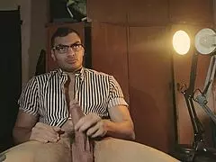 Sexy striped glasses guy strokes big dick solo