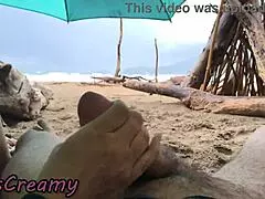 Misscreamy's stormy beach handjob strokes cock to orgasm in 4k public sex