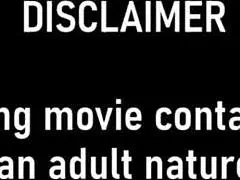 giggles' bare feet tickled sandy on beach close-up