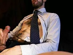 guy in a suit unloads cumshot on his muscular chest in office